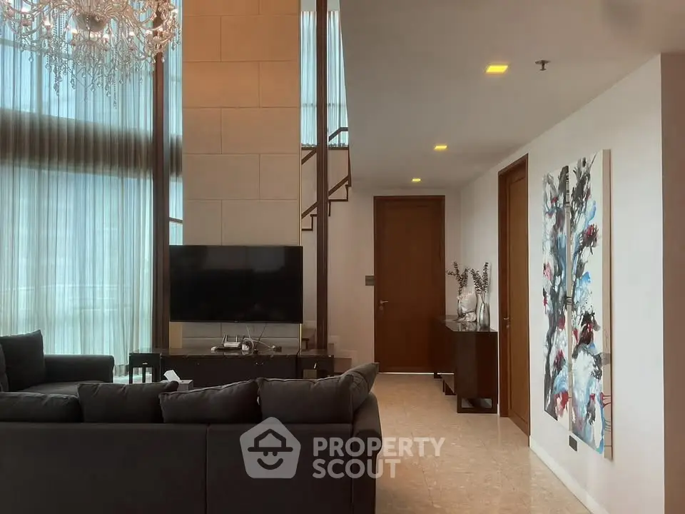 Luxurious living room with high ceilings and elegant decor
