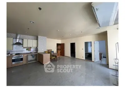 Spacious open-layout kitchen and dining area with modern appliances