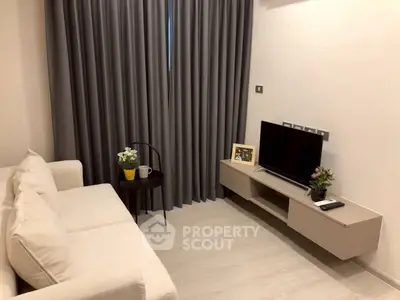 Modern living room with cozy sofa and sleek TV setup