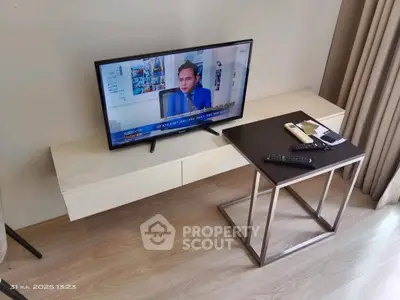 Modern living room with sleek TV setup and stylish furniture