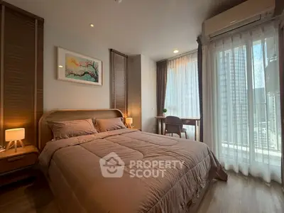 Modern bedroom with city view, cozy lighting, and stylish decor