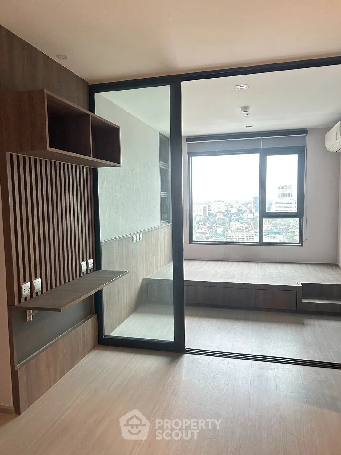 Modern living room with large windows and stunning city view