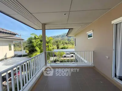 Spacious balcony with scenic mountain view in modern home