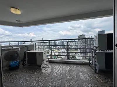Spacious balcony with stunning city skyline view, perfect for relaxation and enjoying urban living.