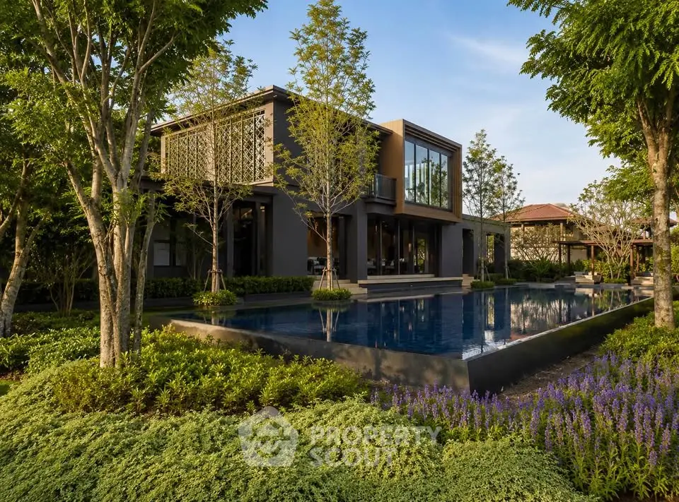 Luxurious modern home with stunning garden and pool view, surrounded by lush greenery and elegant architecture.