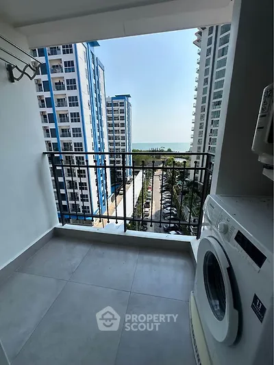 Modern apartment balcony with washing machine and stunning city view