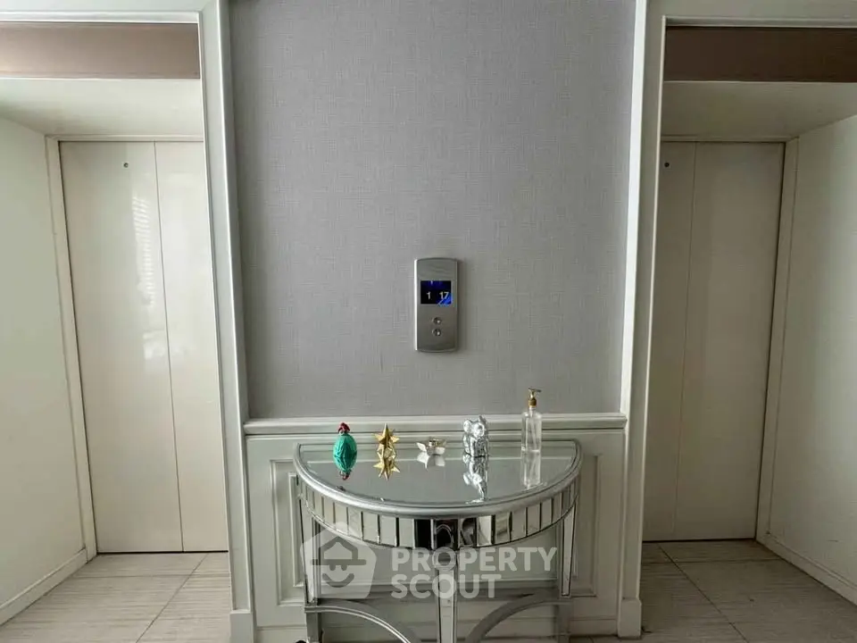 Elegant elevator lobby with stylish console table and modern decor accents
