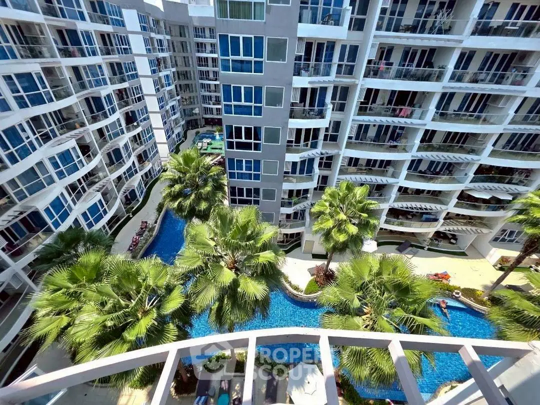 Luxurious condominium with stunning pool view and modern architecture.