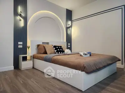 Modern bedroom with stylish lighting and cozy decor