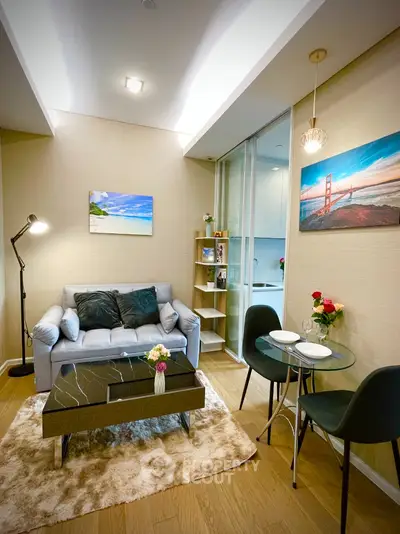 Chic modern living room with cozy sofa, elegant decor, and stylish dining area in a compact apartment.