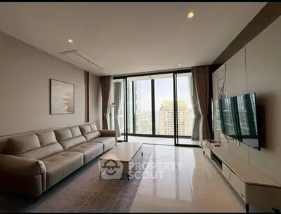 Luxurious modern living room with stunning city view and elegant furnishings.