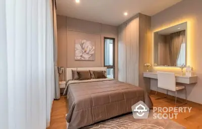 Elegant bedroom with modern decor and soft lighting, featuring a cozy bed and stylish vanity area.