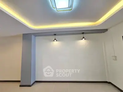 Modern interior with stylish ceiling lights and sleek tile flooring