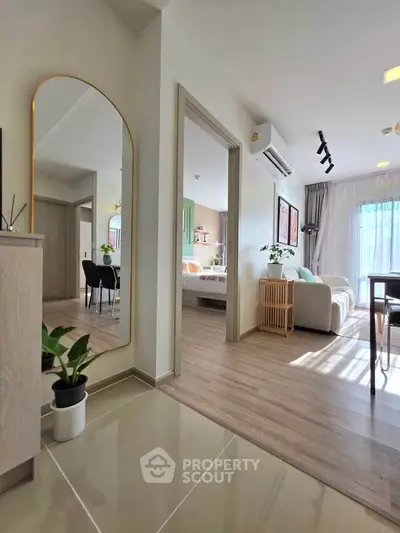 Modern open-plan living room with stylish decor and natural light