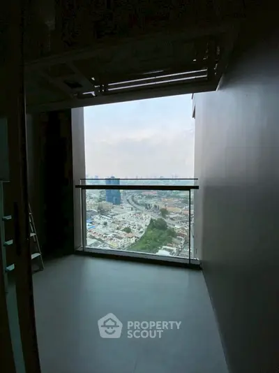 Stunning high-rise balcony with panoramic city view, perfect for urban living.