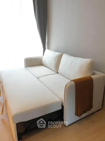 Modern living room with stylish white sofa and elegant decor
