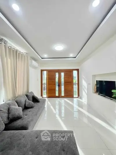 Spacious modern living room with sleek design and natural light