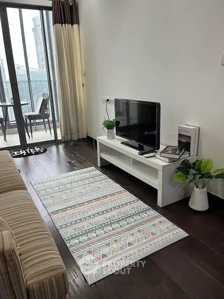 Stylish living room with modern decor and balcony view