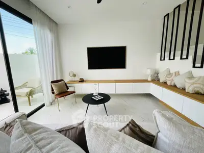 Modern living room with sleek design, large windows, and stylish furniture for a luxurious lifestyle.