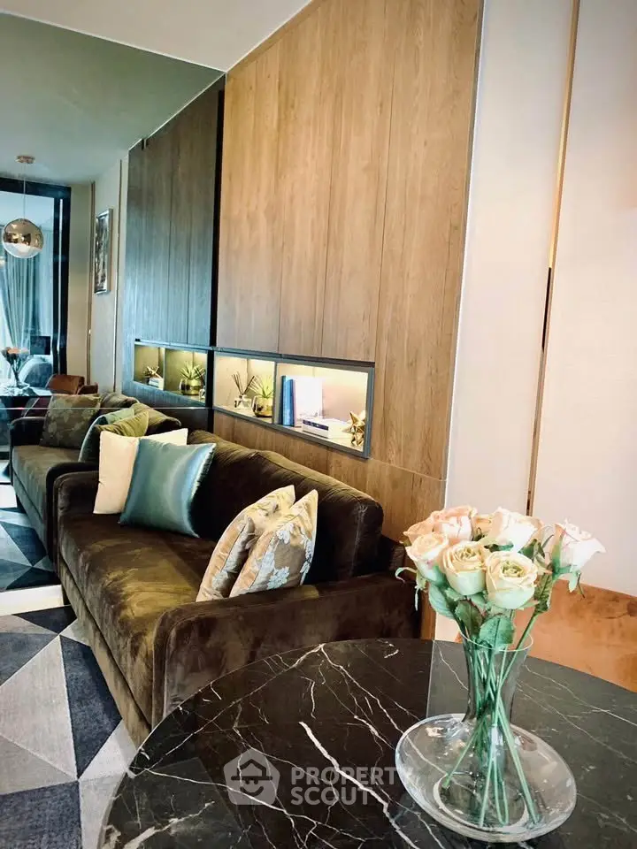 Luxurious living room with elegant decor and plush seating in modern apartment.