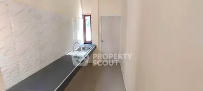 Sleek minimalist kitchen with modern sink and ample counter space
