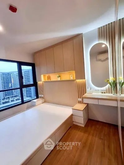 Modern bedroom with built-in storage and city view window