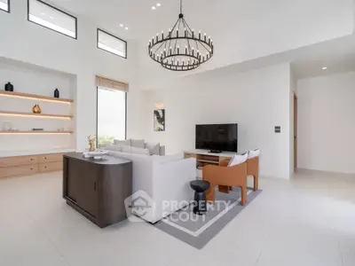 Spacious modern living room with elegant chandelier and stylish furniture