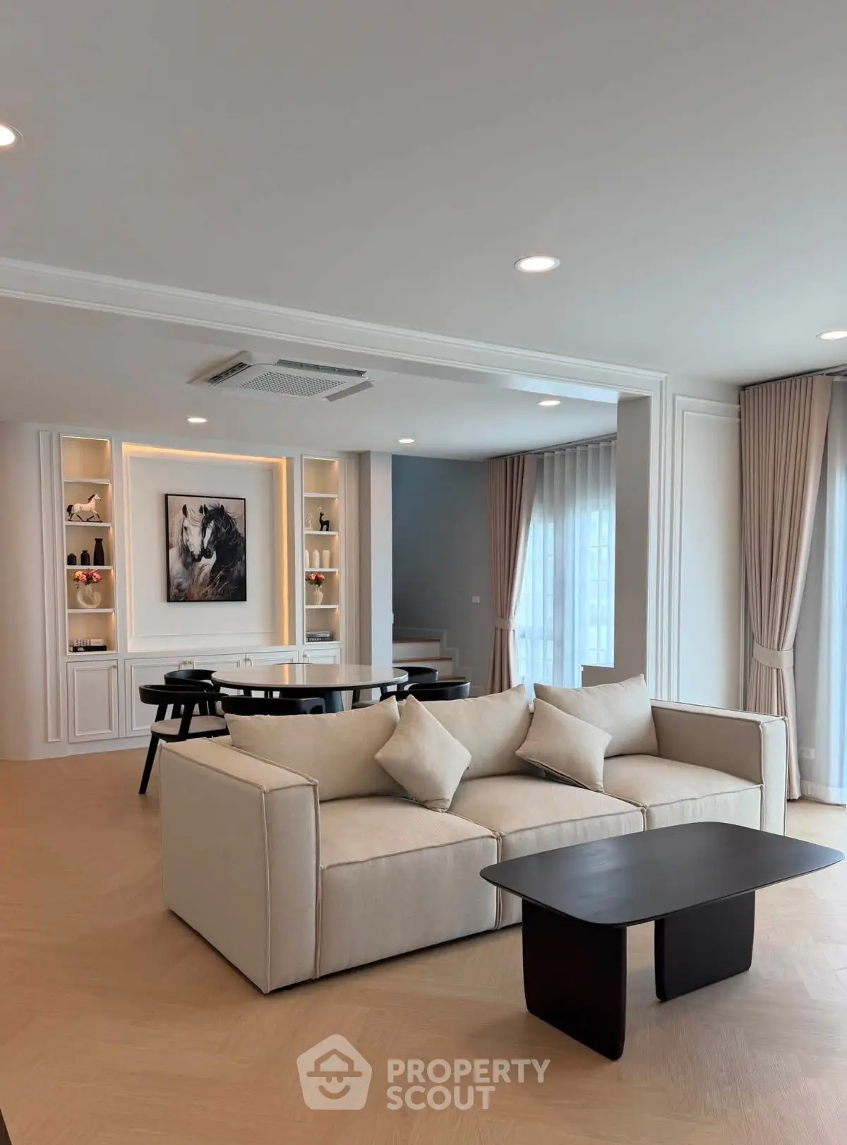 Luxurious modern living room with elegant beige sofa and stylish decor