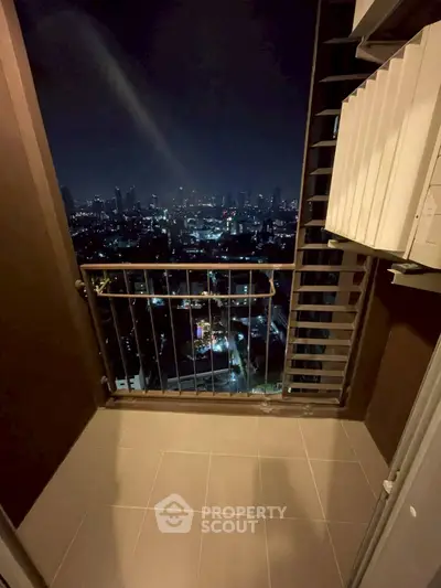 Stunning cityscape view from a high-rise balcony at night, perfect for urban living enthusiasts.