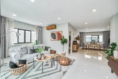 Spacious modern living room with elegant decor and abundant natural light