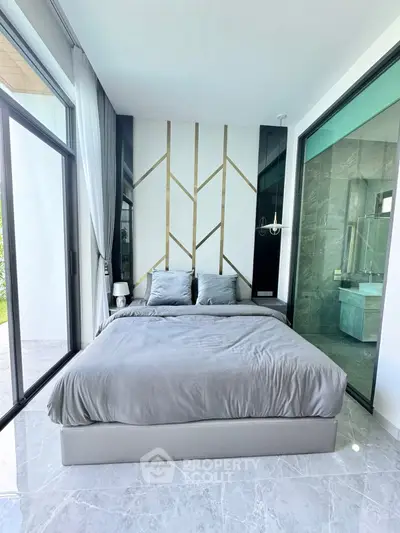 Luxurious modern bedroom with elegant decor and large windows