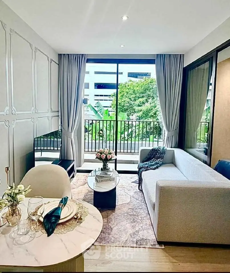 Modern living room with elegant decor and large window overlooking greenery, perfect for urban living.