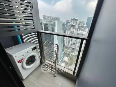 High-rise balcony with city view and washing machine, perfect for urban living.