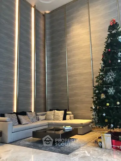 Luxurious modern living room with high ceilings and elegant Christmas decor