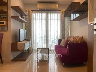 Modern living room with vibrant sofa and sleek shelving, featuring a large window with natural light.