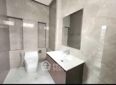 Luxurious modern bathroom with sleek fixtures and elegant marble finishes.
