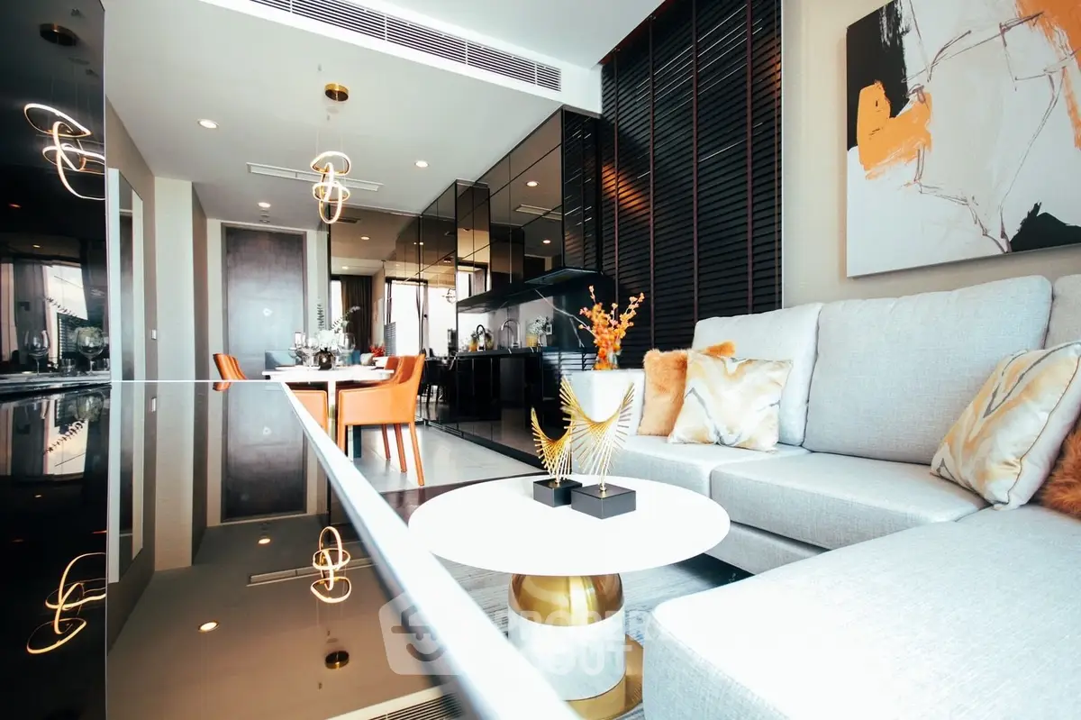 Luxurious modern living room with elegant decor and open layout, featuring stylish furniture and ambient lighting.
