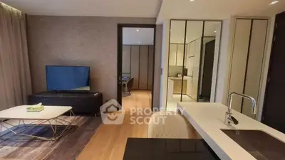 Modern open-plan living room with sleek kitchen and stylish decor