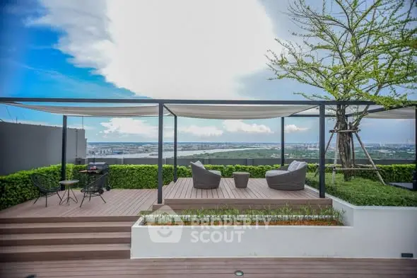 Stunning rooftop terrace with panoramic city views and modern outdoor seating.