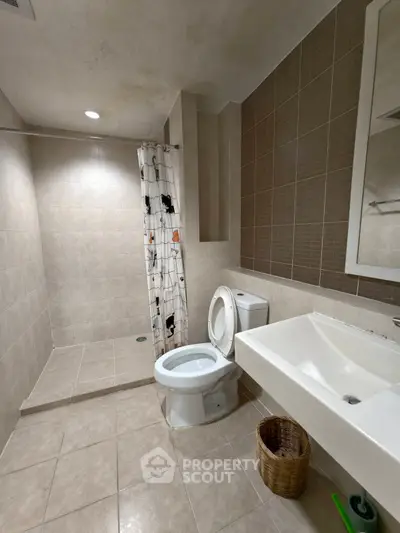 Spacious bathroom with modern fixtures and walk-in shower