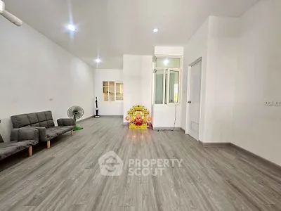 Spacious minimalist living room with modern flooring and simple decor