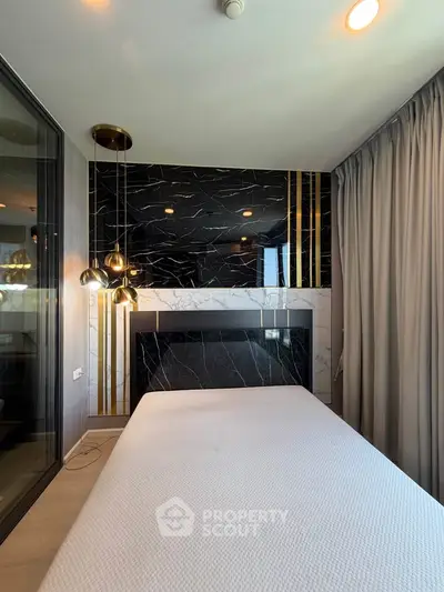 Luxurious bedroom with modern design and elegant lighting fixtures