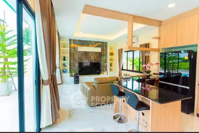 Luxurious open-plan living room with modern kitchen and stylish decor
