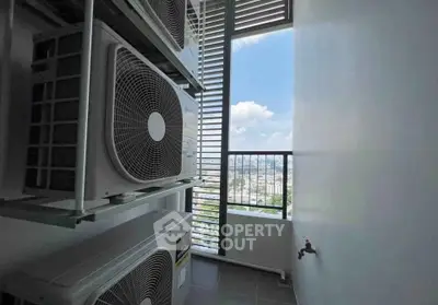 High-rise balcony with air conditioning units and city view, perfect for urban living.
