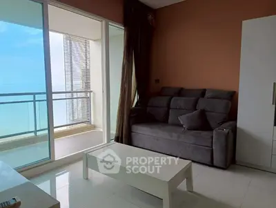Modern living room with ocean view balcony in luxury apartment