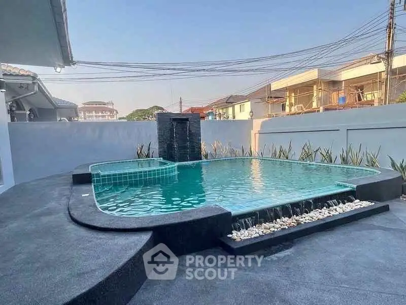 Luxurious private pool with modern design and serene surroundings in a residential area.