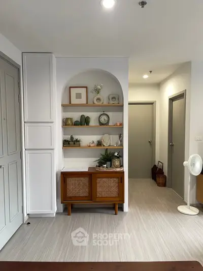 Charming interior with stylish shelving and modern decor in a cozy living space.