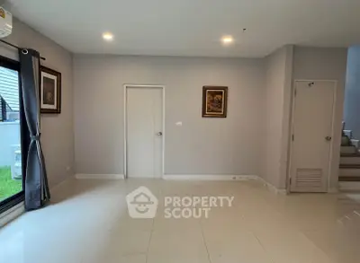 Spacious empty living room with modern decor and natural light