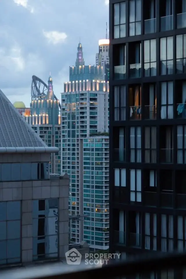 Stunning cityscape view of modern high-rise buildings at dusk, showcasing urban architectural elegance.