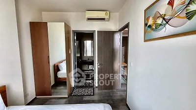 Modern bedroom with air conditioning and stylish decor in a contemporary apartment.